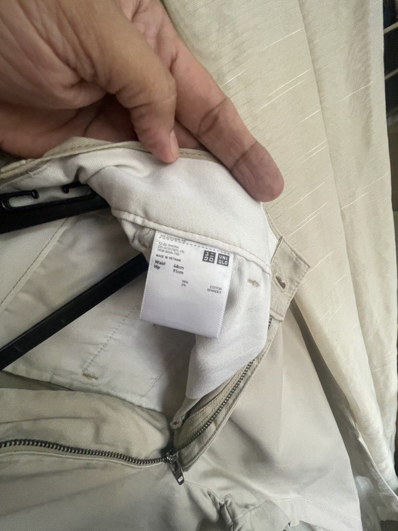 Uniqlo Beige Pants (Category: Trousers) located in Mandaluyong City. Submitted by coolmeybab (Listing ID 1469459356, Image 3). Description: - Brand: Uniqlo - Color: Beige - Size: Waist 64cm / Hip 91cm - Material: Cotton and spandex (with stretch) - Closure: Zipper fly with button - Pockets: Two back welt pockets with button detail - Condition: Clean and ready to wear.