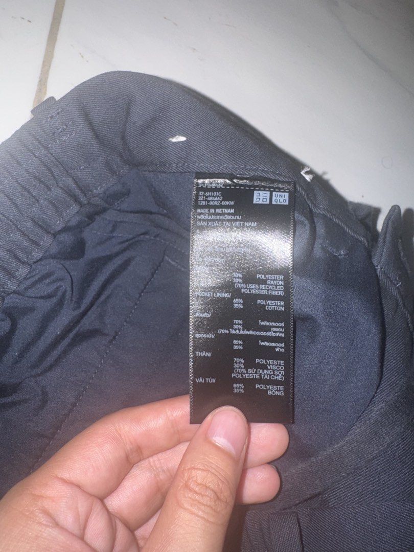 Uniqlo C Wide Tapered Pleated Trousers (Category: Trousers) located in Taguig. Submitted by coolmoon_f83a85 (Listing ID 1469543473, Image 3). Description: - Brand: Uniqlo - Color: Classic Black - Style: Pleated front with regular fit - Waistband: Drawstring waist with belt loops - Pockets: Functional back pockets - Material: Comfortable polyester and rayon blend - Origin: Made in Vietnam - Versatility: Great for casual or smart wear.