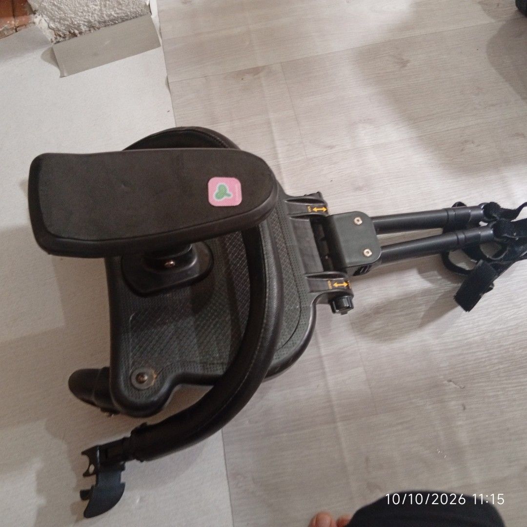 Universal Stroller Board with Seat and Handlebar (Category: Strollers) located in Taguig. Submitted by manilyn_lau (Listing ID 1469548619, Image 3). Description: - Universal connector arms fit most standard strollers easily - Features a padded seat and curved handlebar for riding comfort - Includes safety straps for secure travels - Textured anti-slip standing platform prevents slipping - Ideal for older toddlers who want to stand or sit on the g