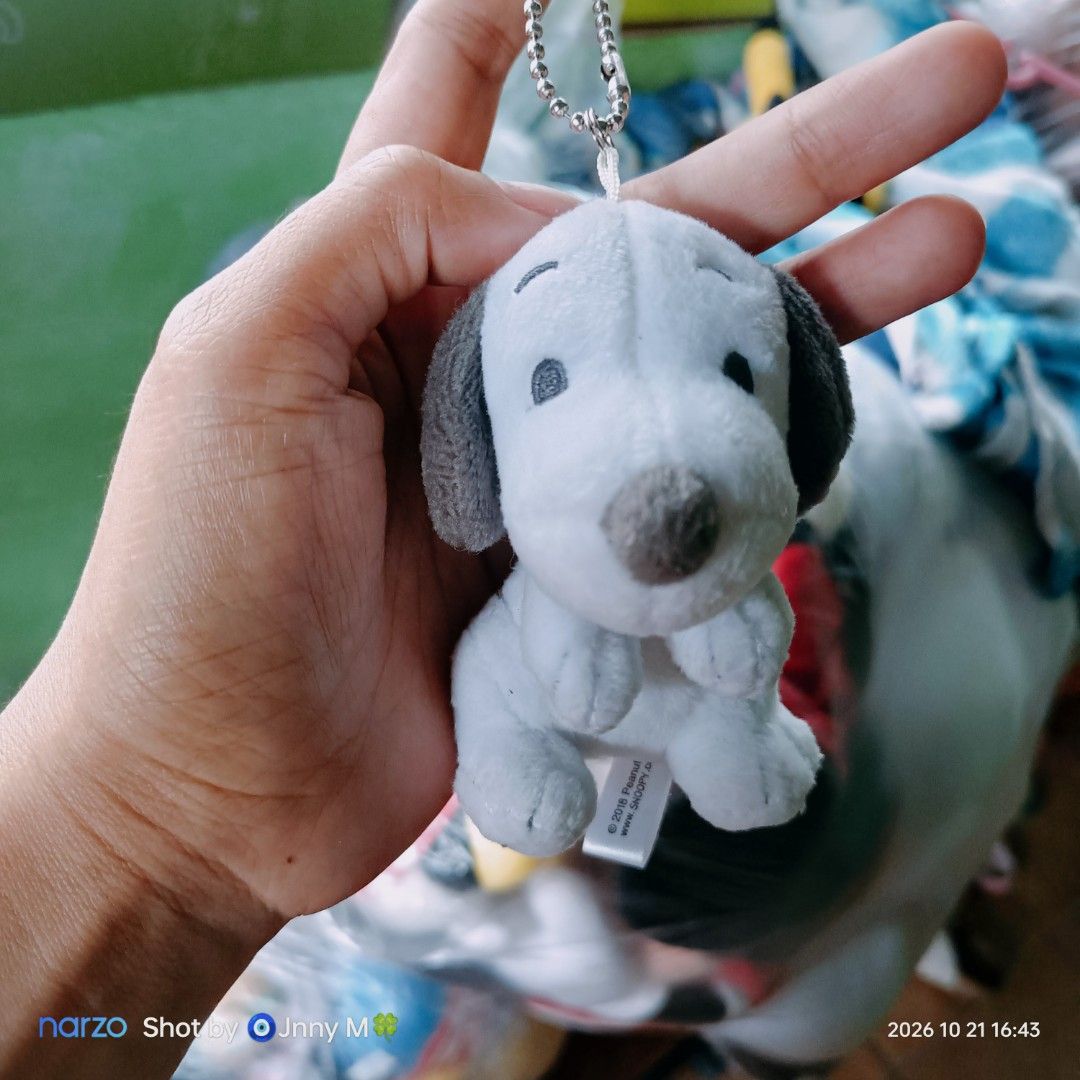 Universal Studios Japan Snoopy Plush Keychain (Category: Plushies & Soft Toys) located in Taguig. Submitted by mhayestufftoys (Listing ID 1469469857, Image 1). Description: - Authentic Universal Studios Japan (USJ) Snoopy plush keychain - Super soft white fur with cute grey floppy ears and detailed stitching - Comes with an attached metal ball chain for easy hanging - Official branding tag intact - Clean, fluffy, and in brand new-like condition.