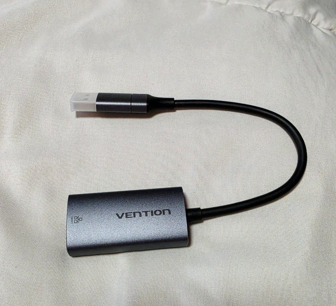 USB-C/USB-A to Gigabit Ethernet Adapter Model CFQHB (Category: Cables & Adaptors) located in Las Pinas. Submitted by stardust070 (Listing ID 1469410489, Image 1). Description: - Model: CFQHB Ethernet Adapter - Condition: Clean, working unit - Connectivity: Works with both USB-C and USB-A ports - Speed: Gigabit capability for fast, stable internet - Build: Premium grey aluminum housing with a built-in short cable - Compatibility: Ideal for laptops