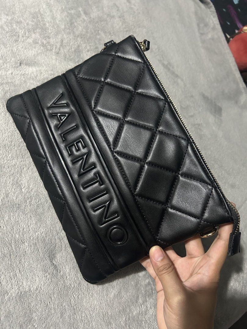 Valentino clutch bag (Category: Cross-body Bags) located in Quezon City. Submitted by findsbyme_ (Listing ID 1469475351, Image 2). Description: Brandnew with tag With minor flaws nka stock lang kasi .