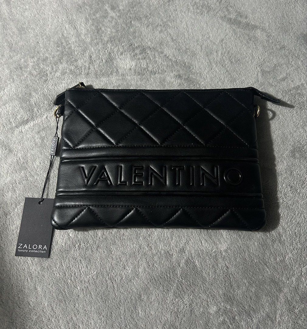 Valentino clutch bag (Category: Cross-body Bags) located in Quezon City. Submitted by findsbyme_ (Listing ID 1469475351, Image 1). Description: Brandnew with tag With minor flaws nka stock lang kasi .