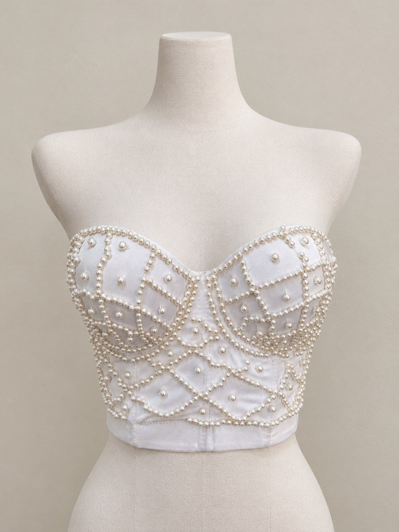 Vanity Me White Pearl Corset Bustier (Category: Sleeveless) located in Santa Cruz. Submitted by zellethrifts (Listing ID 1465528750, Image 1). Description: • Bought in Japan 🇯🇵 • Used / Excellent condition • Fits Medium to large 🚚 Shipping via J&T only 📦 Shipping fee to be shouldered by buyer 💳 Mode of payment: GCash 📍 Santa Cruz, Laguna.