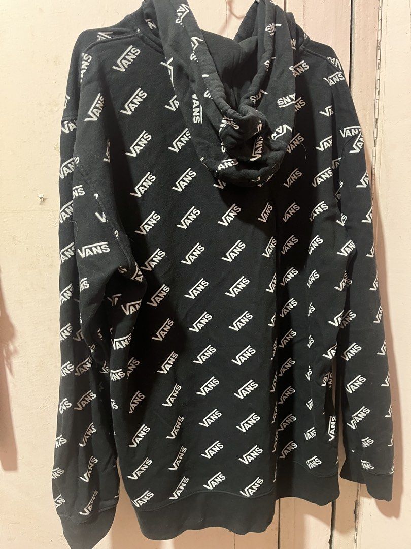 Vans All Over Print Black Hoodie (Category: Hoodies) located in Manila. Submitted by pinkmowchiiii (Listing ID 1469512333, Image 2). Description: - Color: Black with all-over white Vans text print - Style: Standard fit hooded sweatshirt - Storage: Front kangaroo pocket - Features: Adjustable drawstring hood, ribbed cuffs and hem - Material: Soft and comfortable cotton blend - Condition: Great for casual everyday wear.