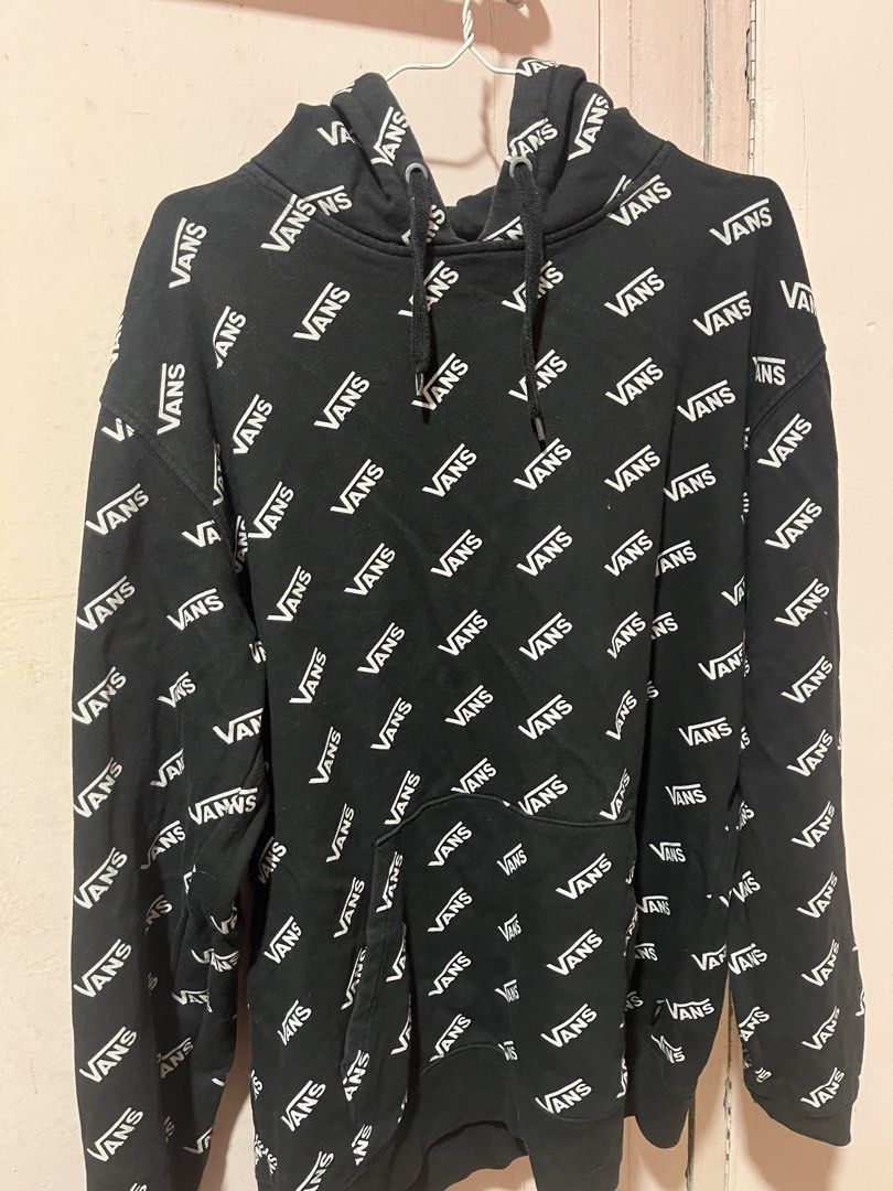 Vans All Over Print Black Hoodie (Category: Hoodies) located in Manila. Submitted by pinkmowchiiii (Listing ID 1469512333, Image 1). Description: - Color: Black with all-over white Vans text print - Style: Standard fit hooded sweatshirt - Storage: Front kangaroo pocket - Features: Adjustable drawstring hood, ribbed cuffs and hem - Material: Soft and comfortable cotton blend - Condition: Great for casual everyday wear.