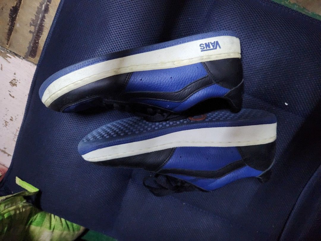 Vans Blue and Black Leather Sneakers (Category: Sneakers) located in Quezon City. Submitted by amber___18 (Listing ID 1469489369, Image 2). Description: - Brand: Vans - Colorway: Blue and Black Leather - Style: Classic low-top everyday trainers - Details: Black laces, side/back text branding, signature blue waffle outsoles with orange heel patch - Condition: Good pre-loved condition with minor dirt/wear on white midsoles - Perfect for daily casua