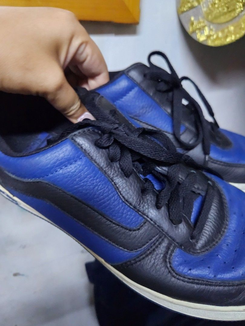 Vans Blue and Black Leather Sneakers (Category: Sneakers) located in Quezon City. Submitted by amber___18 (Listing ID 1469489369, Image 3). Description: - Brand: Vans - Colorway: Blue and Black Leather - Style: Classic low-top everyday trainers - Details: Black laces, side/back text branding, signature blue waffle outsoles with orange heel patch - Condition: Good pre-loved condition with minor dirt/wear on white midsoles - Perfect for daily casua