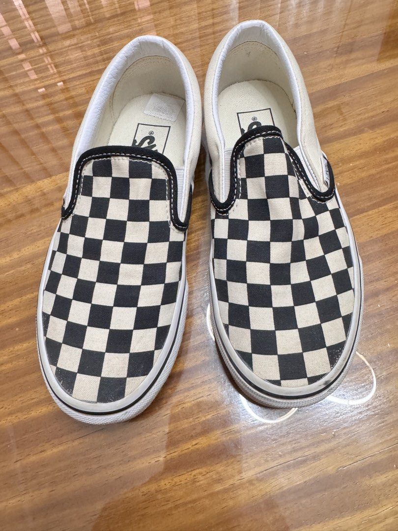 Vans Classic Checkerboard Slip-On Sneakers (Category: Sneakers) located in Batangas. Submitted by ayeeftz (Listing ID 1469424494, Image 1). Description: - Style: Classic slip-on with iconic black and white checkerboard pattern - Size: US Men 3.5 / US Women 5 / EUR 34.5 / 21.5 cm - Details: Features elastic side accents and red 'Off The Wall' heel license plate.