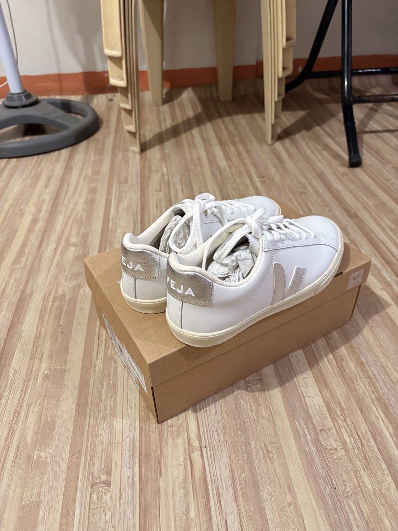 Veja White and Silver Sneakers (Category: Sneakers) located in Manila. Submitted by elaisamq (Listing ID 1469517772, Image 1). Description: - Brand: Veja - Color: White with metallic silver details - Condition: Brand new, unworn, pristine outsoles - Includes: Original shoebox and stuffing paper - Features: White leather upper, off-white rubber sole, silver heel tab and side logo.