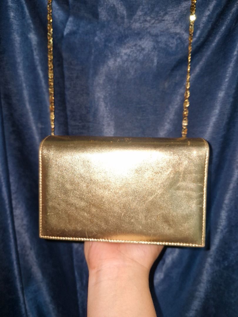 Vintage Bag (Category: Luxury Bags & Wallets) located in Cabuyao City. Submitted by titasolph (Listing ID 1469405103, Image 3). Description: Elegant gold evening bag — timeless piece! • Authentic BOCCI • Made in Italy • Detachable chain strap • Vintage charm & beautiful interior • Good condition for its age 💰 ₱2,500 only! 📍 Laguna 📩 DM to claim!.