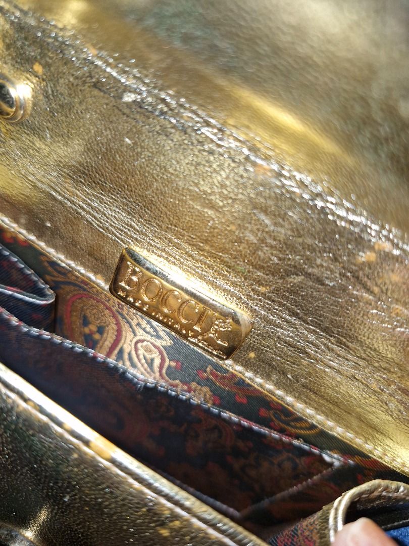 Vintage Bag (Category: Luxury Bags & Wallets) located in Cabuyao City. Submitted by titasolph (Listing ID 1469405103, Image 1). Description: Elegant gold evening bag — timeless piece! • Authentic BOCCI • Made in Italy • Detachable chain strap • Vintage charm & beautiful interior • Good condition for its age 💰 ₱2,500 only! 📍 Laguna 📩 DM to claim!.