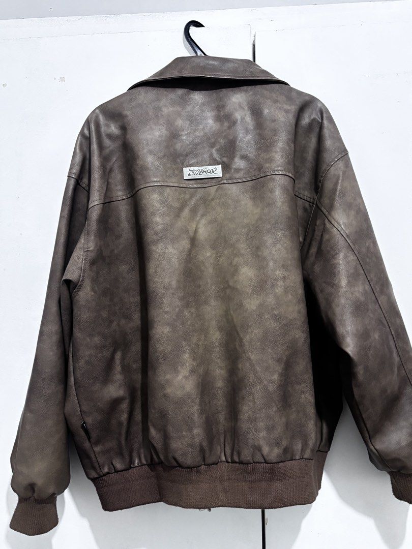 Vintage Brown Leather Jacket (Category: Coats, Jackets and Outerwear) located in Quezon City. Submitted by rou_een (Listing ID 1469497297, Image 2). Description: Faux Leather Bomber Jacket with Subtle Silver Details on the front and Silver Plate Branding on the back. Great Quality and no issues. Contains pocket inside for storage. have a video of it when worn. Only worn personally twice. .