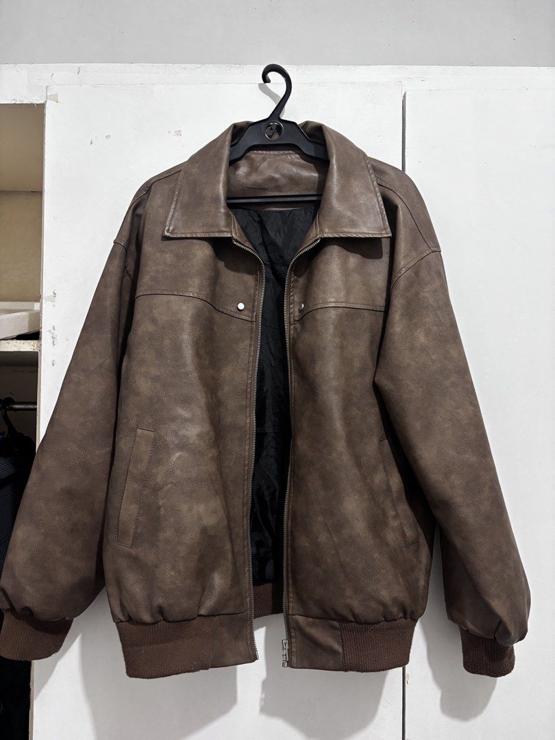 Vintage Brown Leather Jacket (Category: Coats, Jackets and Outerwear) located in Quezon City. Submitted by rou_een (Listing ID 1469497297, Image 1). Description: Faux Leather Bomber Jacket with Subtle Silver Details on the front and Silver Plate Branding on the back. Great Quality and no issues. Contains pocket inside for storage. have a video of it when worn. Only worn personally twice. .