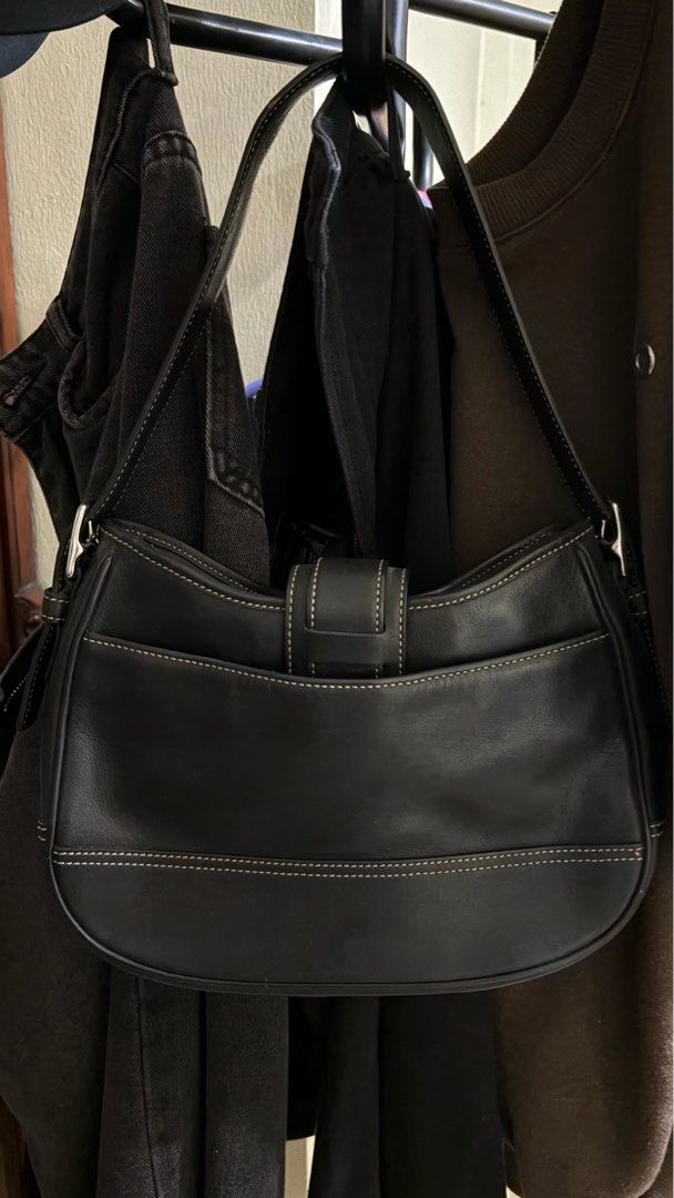Vintage Coach Black Leather Shoulder Bag (Category: Luxury Bags & Wallets) located in Manila. Submitted by declutterwithesca (Listing ID 1469548514, Image 2). Description: - Brand: Coach Y2K vintage shoulder bag - Material: Premium black leather with contrast stitching - Hardware: Silver-tone with front buckle closure and classic hangtag charm - Condition: Well-maintained negotiable for sure buyers :) .