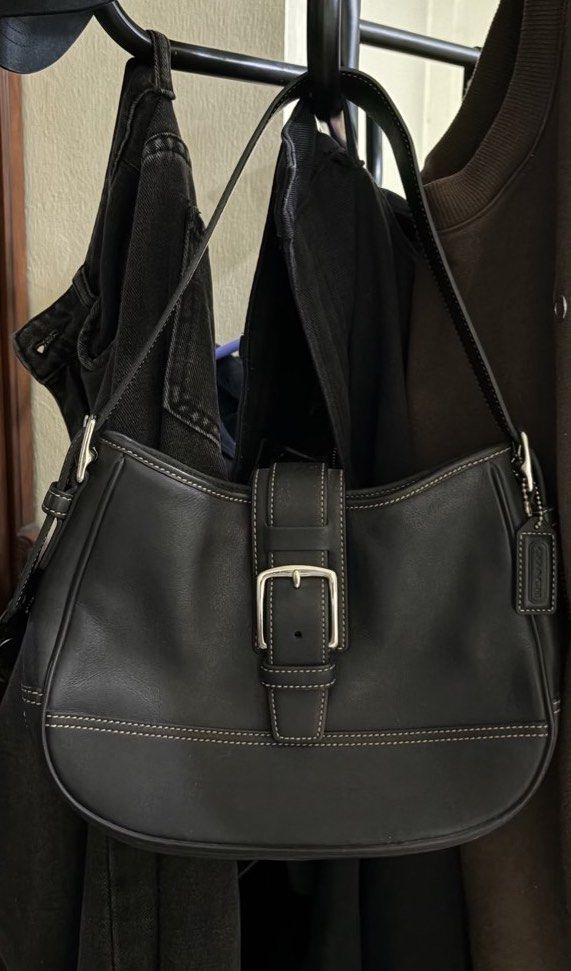 Vintage Coach Black Leather Shoulder Bag (Category: Luxury Bags & Wallets) located in Manila. Submitted by declutterwithesca (Listing ID 1469548514, Image 1). Description: - Brand: Coach Y2K vintage shoulder bag - Material: Premium black leather with contrast stitching - Hardware: Silver-tone with front buckle closure and classic hangtag charm - Condition: Well-maintained negotiable for sure buyers :) .