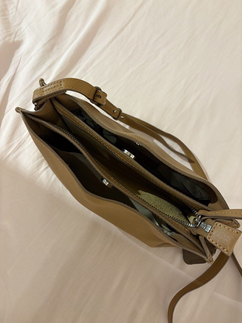 Vintage Crossbody Bag (Category: Cross-body Bags) located in Cebu City. Submitted by superrrr_bubu (Listing ID 1469540181, Image 3). Description: **PLEASE IGNORE SINGAPORE MEET-UP ADDRESS, Serious buyers meet up at Solinea Tower 3 lobby Authentic vintage bag bought in Singapore. Original price at $350 Bag condition is 7/10 Style: Stream-textured leather small shoulder / crossbody square bag Color: Camel Material: Genuine Italian leather with a su