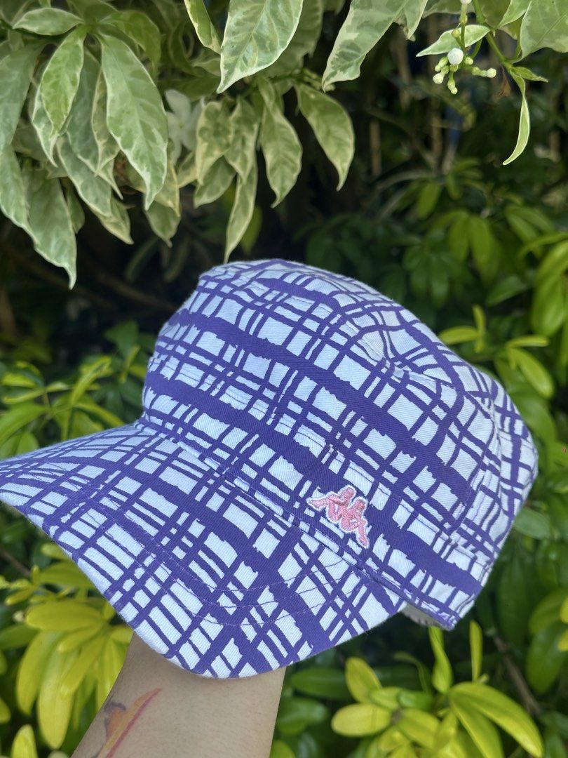 Vintage Kappa Purple Plaid Cap (Category: Caps & Hats) located in Bago City. Submitted by thekasproject (Listing ID 1469469876, Image 2). Description: - Style: Classic vintage streetwear - Design: All-over purple plaid with pink embroidered Kappa logo - Closure: Adjustable strap back with Kappa branding text - Material: 65% polyester, 35% cotton - Condition: Clean, excellent overall condition with no major flaws.