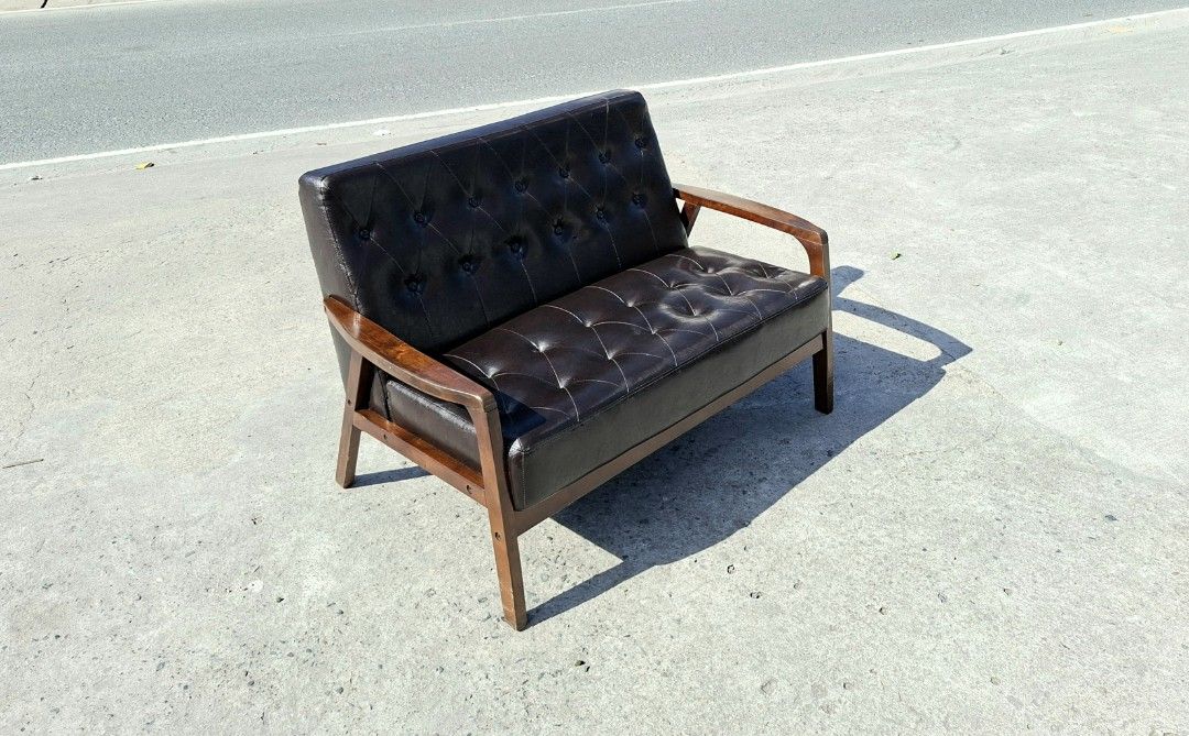 Vintage midcentury 2-seater black sofa (Category: Sofas) located in Mabalacat. Submitted by thenewcraf32843 (Listing ID 1469401243, Image 2). Description: Vintage midcentury 2-seater black sofa In great condition. Made in Japan, nitori. Dimensions: L45.8 x W27.5 x Sh16 x H30.5 inches Price: 8k only We do shipping via lalamove / victory liner drop & go. Dm tp inquire.