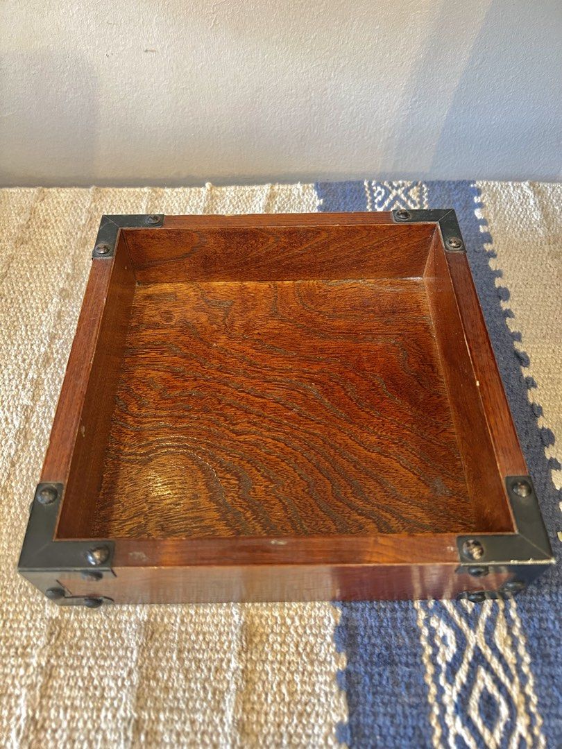 VINTAGE MINI WOODEN BOX (Category: Storage Boxes & Baskets) located in Polangui. Submitted by joycehaul (Listing ID 1469399453, Image 1). Description: • Material: Polished brown or walnut-finished wood with visible grain. • Accents: Black or dark metal corner braces secured with small rivets or screws on the exterior edges. • Shape: Open-top square design. Japan Surplus Items Location: Albay We ship via J&T courier .