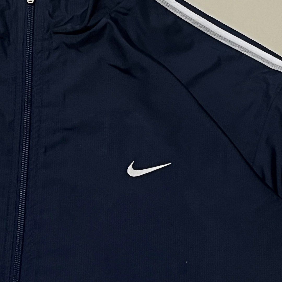VINTAGE NIKE EMBROID SIDE SWOOSH TRACKER JACKET (Category: Coats, Jackets and Outerwear) located in Manila. Submitted by balanse (Listing ID 1469455863, Image 3). Description: SIZE: L ON TAG DIMES: 24W X 28L EXCELLENT CONDITION. 9.9 HONEST COLOR RATE. ISSUE: NON VISIBLE SCRATCH .