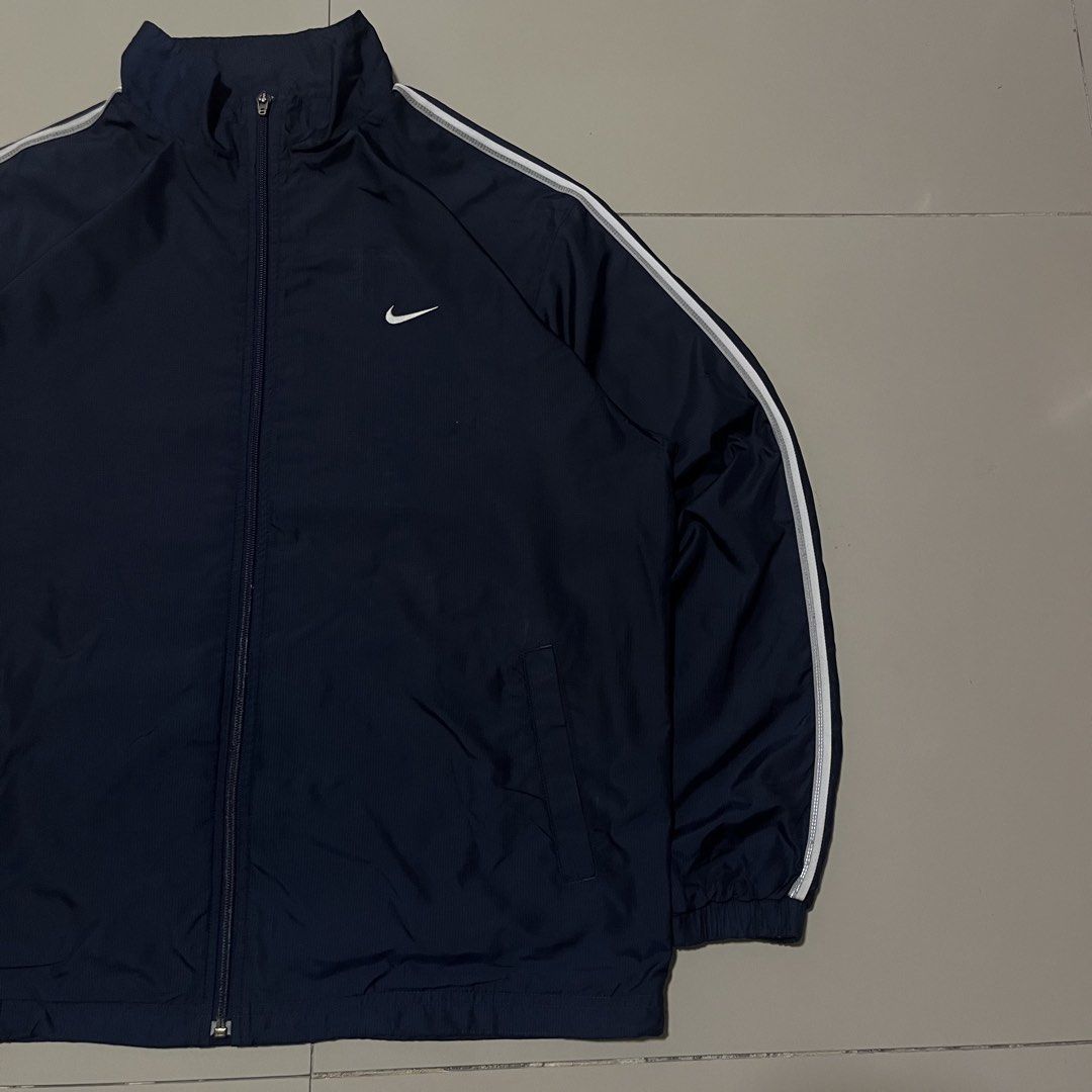 VINTAGE NIKE EMBROID SIDE SWOOSH TRACKER JACKET (Category: Coats, Jackets and Outerwear) located in Manila. Submitted by balanse (Listing ID 1469455863, Image 2). Description: SIZE: L ON TAG DIMES: 24W X 28L EXCELLENT CONDITION. 9.9 HONEST COLOR RATE. ISSUE: NON VISIBLE SCRATCH .