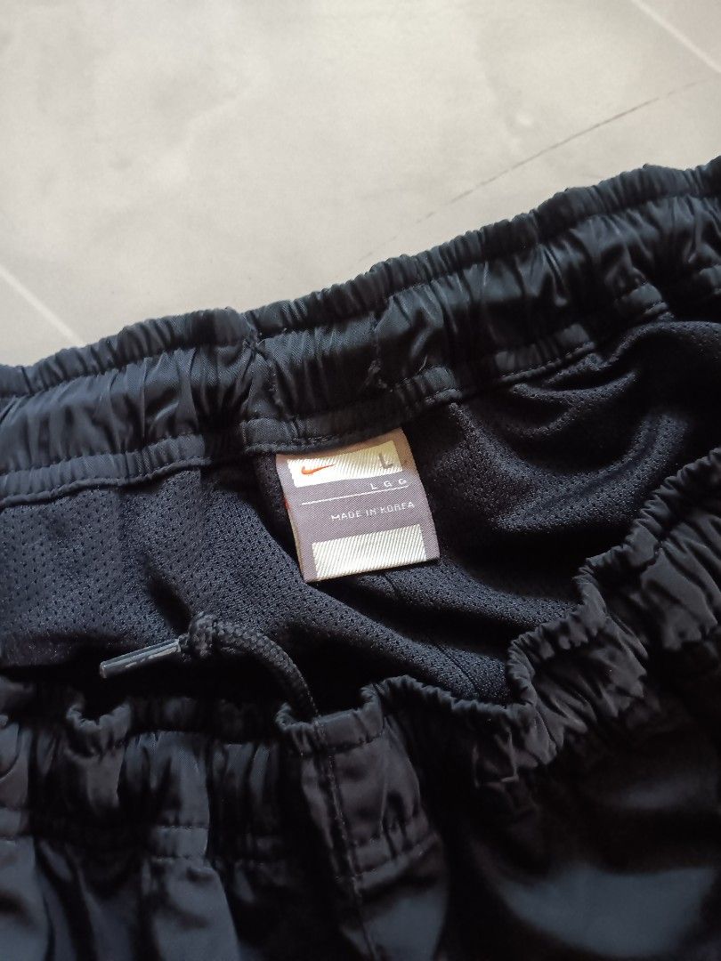 Vintage Nike Track Pants (Category: Joggers) located in Manila. Submitted by kingg6929 (Listing ID 1469522959, Image 3). Description: Vintage Nike Nylon Track pants Black Length - 39.5 Leg Opening-8.