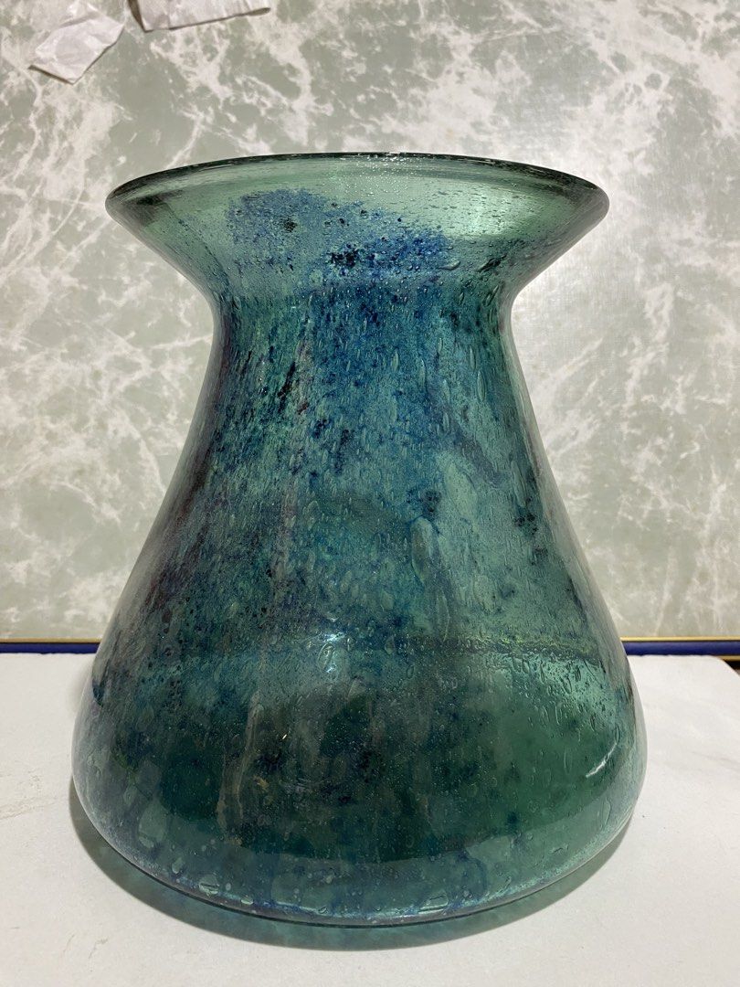 Vintage Recycled Glass Vase (Category: Vases & Decorative Bowls) located in Calamba. Submitted by chebvintagedepot (Listing ID 1469475875, Image 2). Description: (TBOX4-02) Decorative glass vase featuring a mottled teal and sea-green finish with a speckled appearance. It has a bulbous body and a wide, flared rim, giving it a distinctive shape. The vase has the look of hand-blown recycled glass and would make a nice display piece on a shelf, sideb