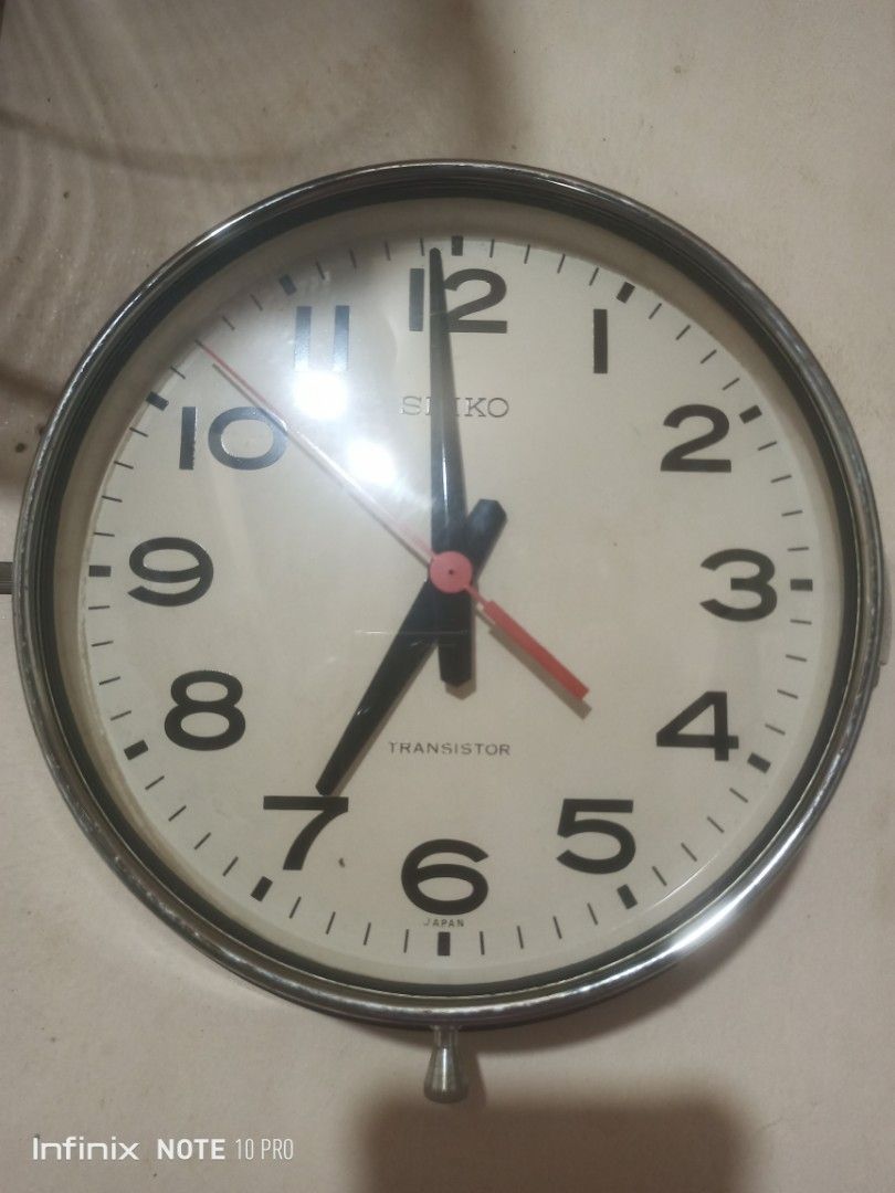 Vintage Seiko Transistor Wall Clock Japan (Category: Clocks) located in Rizal. Submitted by andreisnow (Listing ID 1469396138, Image 3). Description: - Authentic vintage Seiko Transistor wall clock, made in Japan - Classic round shape with a durable metal frame and clear dial face - Bold black numbers and hands with a striking red second hand - Unique design with mechanical movement visible through the back cover - Battery-operated for easy place