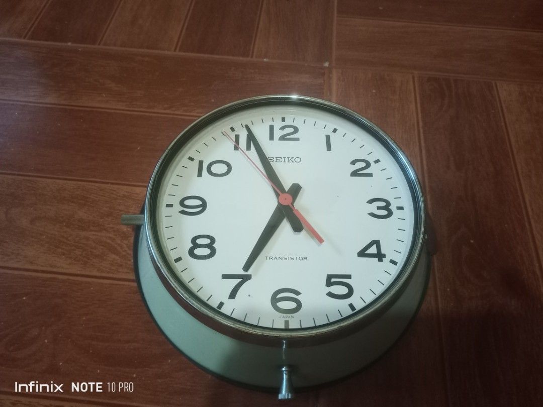 Vintage Seiko Transistor Wall Clock Japan (Category: Clocks) located in Rizal. Submitted by andreisnow (Listing ID 1469396138, Image 2). Description: - Authentic vintage Seiko Transistor wall clock, made in Japan - Classic round shape with a durable metal frame and clear dial face - Bold black numbers and hands with a striking red second hand - Unique design with mechanical movement visible through the back cover - Battery-operated for easy place