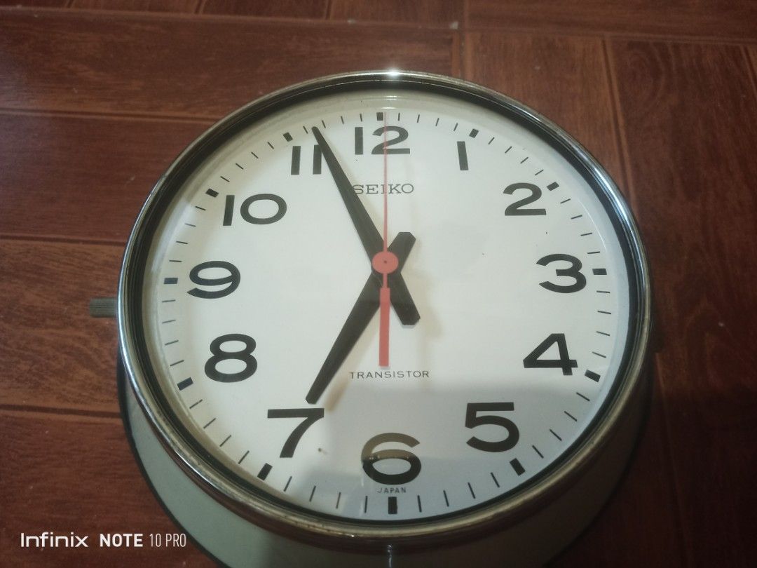 Vintage Seiko Transistor Wall Clock Japan (Category: Clocks) located in Rizal. Submitted by andreisnow (Listing ID 1469396138, Image 1). Description: - Authentic vintage Seiko Transistor wall clock, made in Japan - Classic round shape with a durable metal frame and clear dial face - Bold black numbers and hands with a striking red second hand - Unique design with mechanical movement visible through the back cover - Battery-operated for easy place