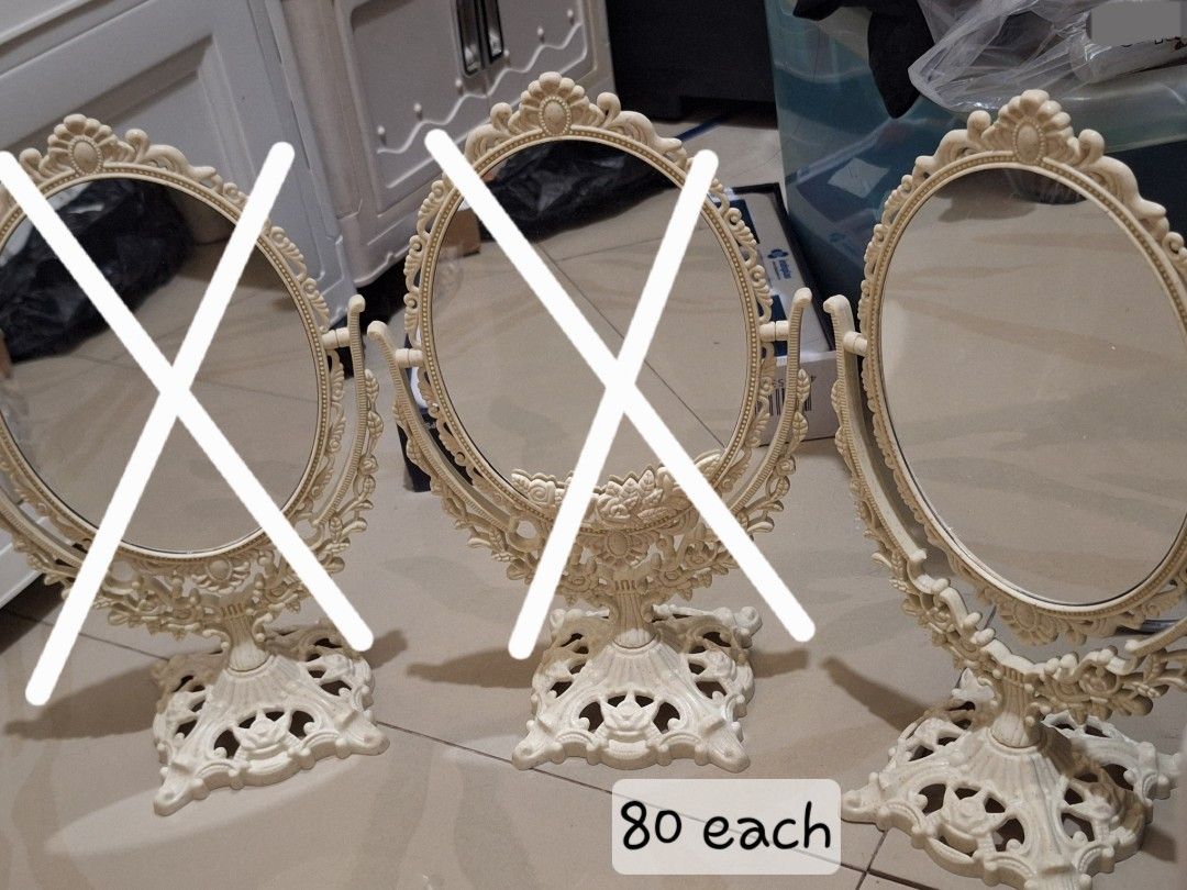 Vintage style ornate desktop vanity mirror (Category: Mirrors) located in Manila. Submitted by noblegem04 (Listing ID 1469564246, Image 1). Description: - Vintage scroll and floral design details - Cream-colored frame with a sturdy base - Rotatable oval glass mirror - Perfect addition to any dressing table or vanity setup - Only 1 piece available - Price: ₱80.