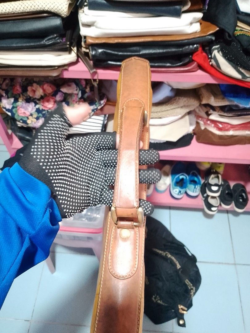 Vintage World Map Print Leather Briefcase Bag (Category: Briefcases) located in Manila. Submitted by romeoamoro00044 (Listing ID 1469493141, Image 2). Description: - Material: Tan leather with antique world map print - Features: Structured interior compartments and sturdy top handle - Closure: Metal push-lock on front flap - Condition: Minor natural wear along edges and corners from regular use - Perfect for work, school, or travel.