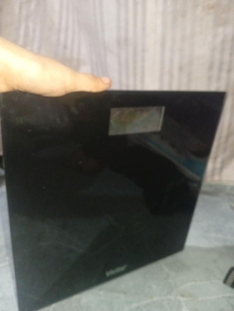 Vivitar Digital Bath Scale Model PS-V132-B (Category: Health Monitors & Weighing Scales) located in Caloocan City. Submitted by grandcloud.a0efa7 (Listing ID 1469417728, Image 3). Description: - Brand: Vivitar (Model: PS-V132-B) - Design: Sleek black glass platform with a compact profile - Display: Clear and easy-to-read top LCD screen - Stability: Four sturdy feet designed for bathroom tiles - Power: Uses 1x 3V CR2032 coin cell battery (included