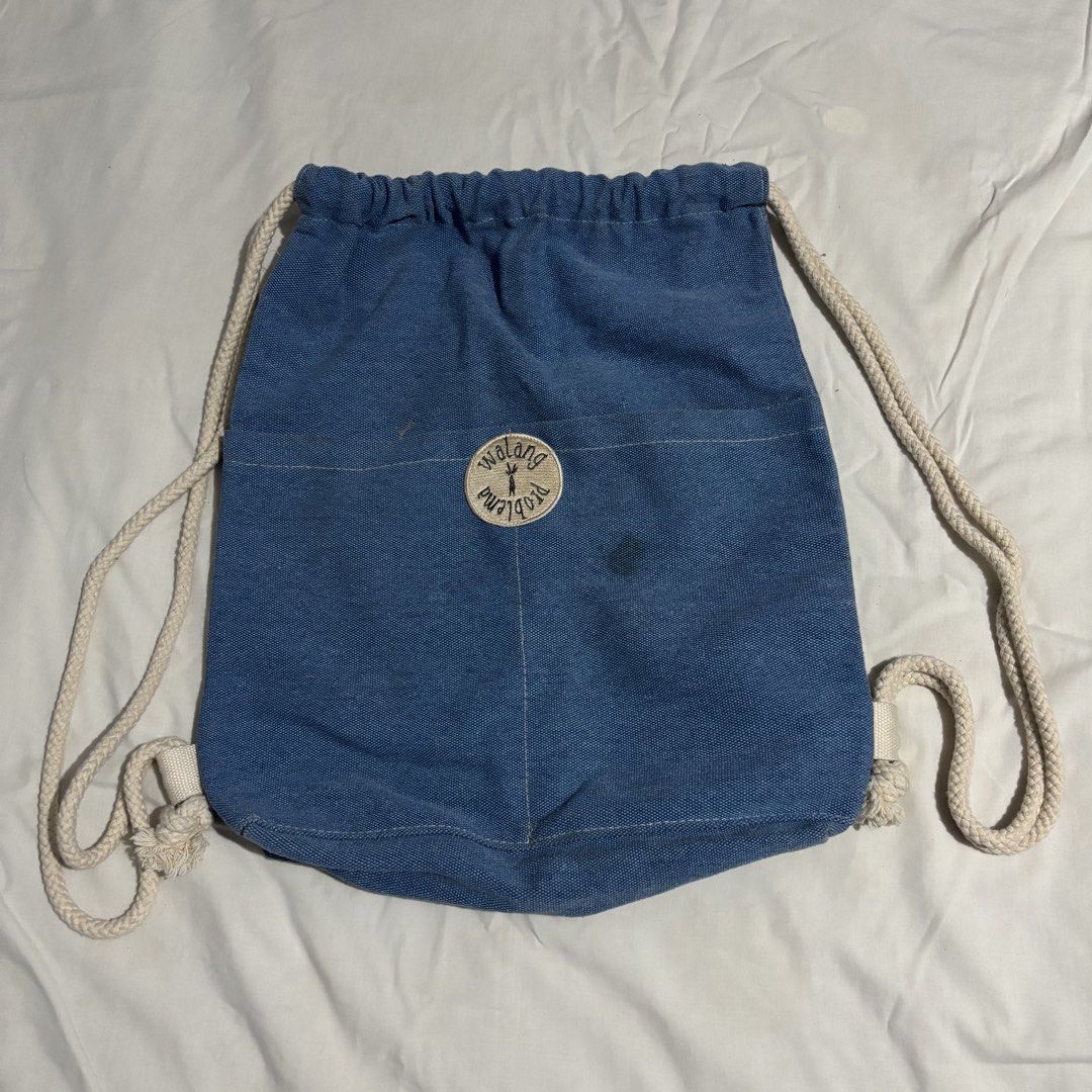 walang problema denim blue drawstring bag (Category: Backpacks) located in Las Pinas. Submitted by tteok0325 (Listing ID 1469533009, Image 1). Description: - blue denim-style canvas drawstring backpack - with thick white rope straps - bought in el nido - has stains but can be washed naman mop: gcash or maribank mod: jnt or lalamove.