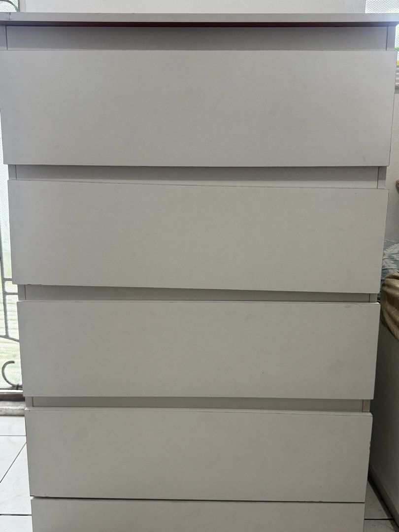 RUSH: White 4-Drawer Dresser (Category: Shelves, Cabinets & Racks) located in Caloocan City. Submitted by mwiideclutters (Listing ID 1469436511, Image 2). Description: Selling for less than its original purchase price of ₱3,000 due to some undisclosed flaws from the previous seller. Purchased on 18 October 2026 via Carousell. 👉🏼Brand unknown but inspired by IKEA furniture! #TeamWhite 👉🏼Measurements: 90 cm (H) × 60 cm (L) × 41 cm (W) 👉🏼Mater
