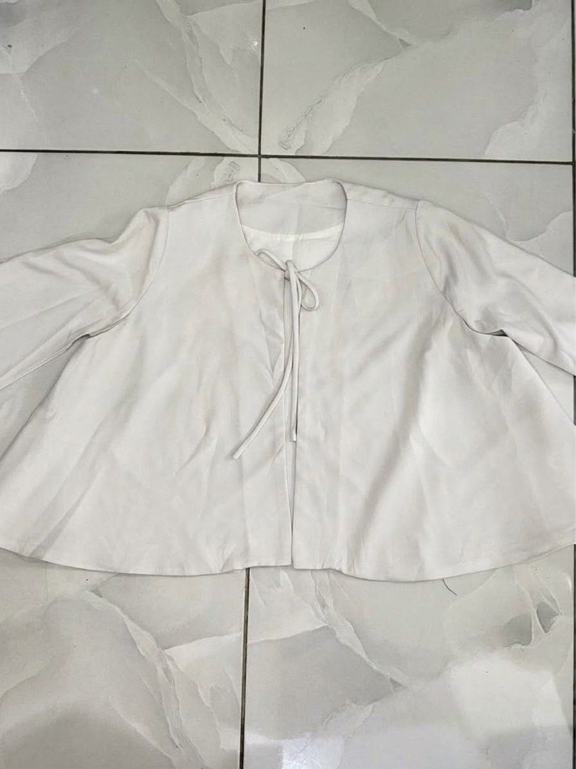 White Cape Style Open Front Cardigan with Tie Bow (Category: Coats, Jackets and Outerwear) located in Cagayan de Oro. Submitted by ninaaam (Listing ID 1469429930, Image 1). Description: - Color: White - Style: Open-front cardigan with split sleeves - Detail: Cute tie bow closure at the collar - Fabric: Light, flowy material that drapes nicely - Versatility: Perfect for layering over tops and dresses.