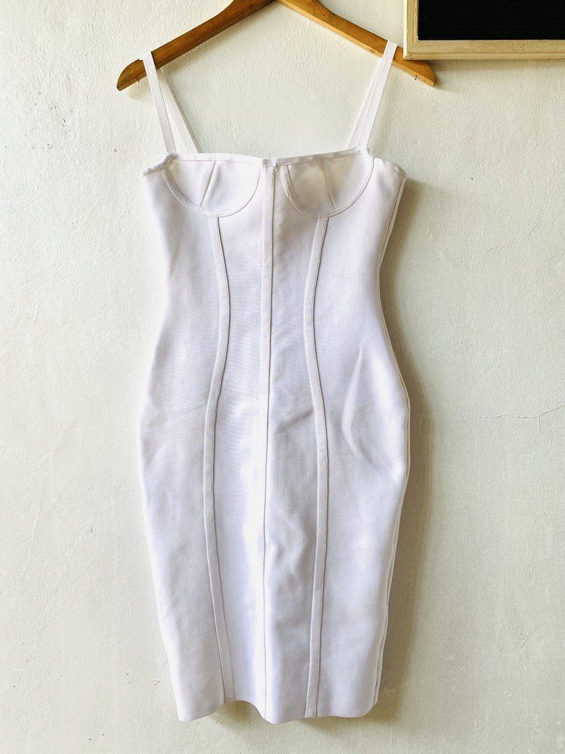 White Corset Bodycon Maxi Dress (Category: Dresses) located in Caloocan City. Submitted by lovemyclothes21 (Listing ID 1469464279, Image 2). Description: - Color: Clean, crisp white - Style: Bodycon midi dress with a fitted, curve-hugging silhouette - Details: Structured corset seaming, underwire cups, and thin spaghetti straps - Closure: Convenient back zipper - Size: Small (based on hanger tag).