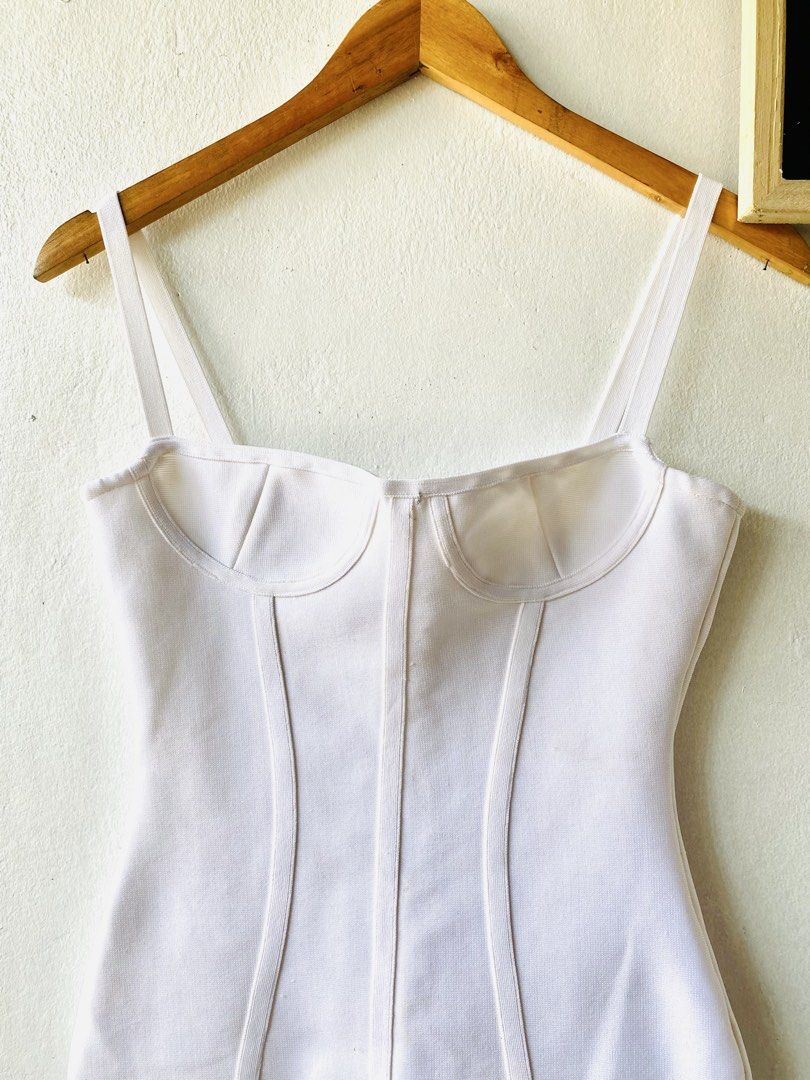 White Corset Bodycon Maxi Dress (Category: Dresses) located in Caloocan City. Submitted by lovemyclothes21 (Listing ID 1469464279, Image 3). Description: - Color: Clean, crisp white - Style: Bodycon midi dress with a fitted, curve-hugging silhouette - Details: Structured corset seaming, underwire cups, and thin spaghetti straps - Closure: Convenient back zipper - Size: Small (based on hanger tag).
