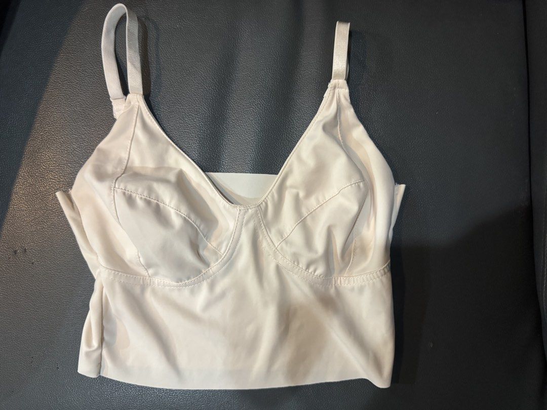 White Corset Style Crop Top with Adjustable Straps (Category: Sleeveless) located in Manila. Submitted by decluterthings888 (Listing ID 1469427525, Image 1). Description: - Color: White - Style: Crop top with straight neckline and structured underwire cups - Straps: Adjustable slim straps - Material: Smooth, stretchy fabric with panel stitching details - Condition: Excellent, clean, no stains or flaws - Versatility: Great basic for layering or pa