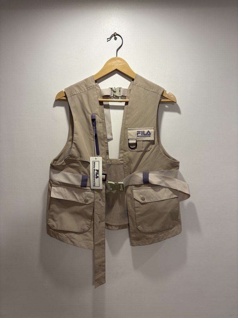 White Mountaineering x Fila Multipocket Utility Vest (Category: Coats, Jackets and Outerwear) located in Bacolod City. Submitted by moboandmoga (Listing ID 1469423318, Image 3). Description: White Mountaineering x Fila Multipocket Utility Vest Size: Medium frame Brand new! W/Tag! (Sizing info) Width: 20 inches Length: 24.5F - 22.2B.