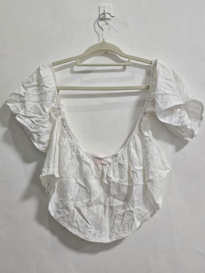White off shoulder crop top (Category: Sleeveless) located in Los Banos. Submitted by itsmecathey (Listing ID 1469554978, Image 3). Description: Fit to Medium (Bust 34-36).