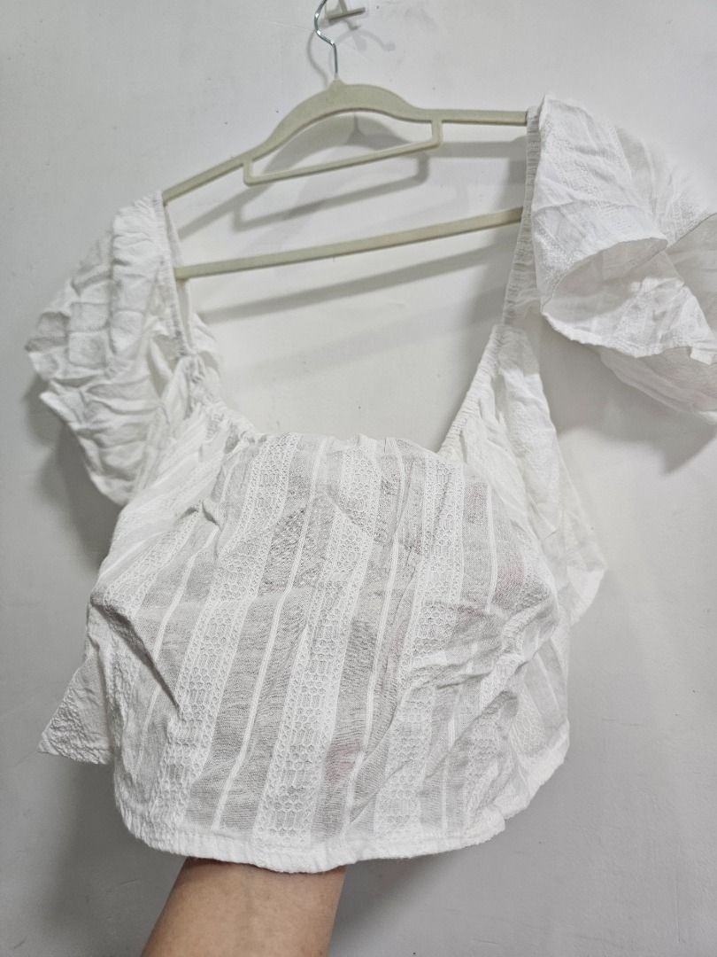 White off shoulder crop top (Category: Sleeveless) located in Los Banos. Submitted by itsmecathey (Listing ID 1469554978, Image 2). Description: Fit to Medium (Bust 34-36).