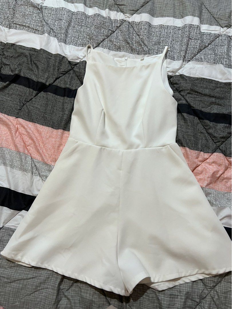 White sleeveless high neck romper suit (Category: Rompers) located in Manila. Submitted by sph_preloved (Listing ID 1469514396, Image 1). Description: Price not negotiable unless buying at least 5 items. No ww photos. Location: QC Mode of delivery: grab/lalamove SF to be shouldered by the buyer .