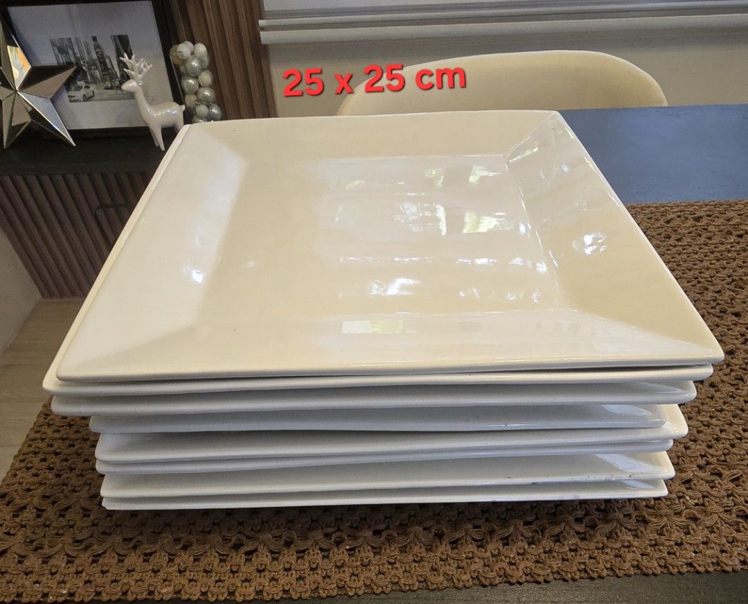 White Square Ceramic Plates Set (12 pcs) (Category: Dinnerware & Cutlery) located in Quezon City. Submitted by favestuff (Listing ID 1469415234, Image 2). Description: - Set of white square ceramic plates in two convenient sizes - Large plates: 25 x 25 cm - Small plates: 19 x 19 cm - Sleek glossy finish with a clean, minimalist look - Space-saving stackable design - Sturdy and durable, ideal for daily meals or hosting dinner parties - No damage; 