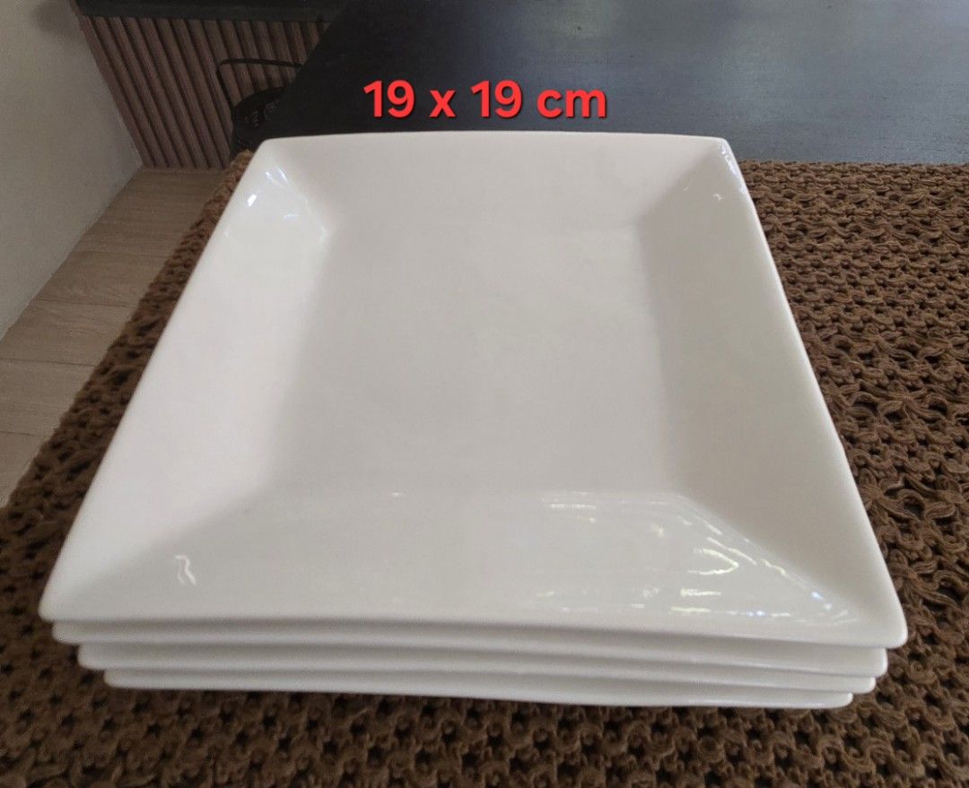 White Square Ceramic Plates Set (12 pcs) (Category: Dinnerware & Cutlery) located in Quezon City. Submitted by favestuff (Listing ID 1469415234, Image 3). Description: - Set of white square ceramic plates in two convenient sizes - Large plates: 25 x 25 cm - Small plates: 19 x 19 cm - Sleek glossy finish with a clean, minimalist look - Space-saving stackable design - Sturdy and durable, ideal for daily meals or hosting dinner parties - No damage; 