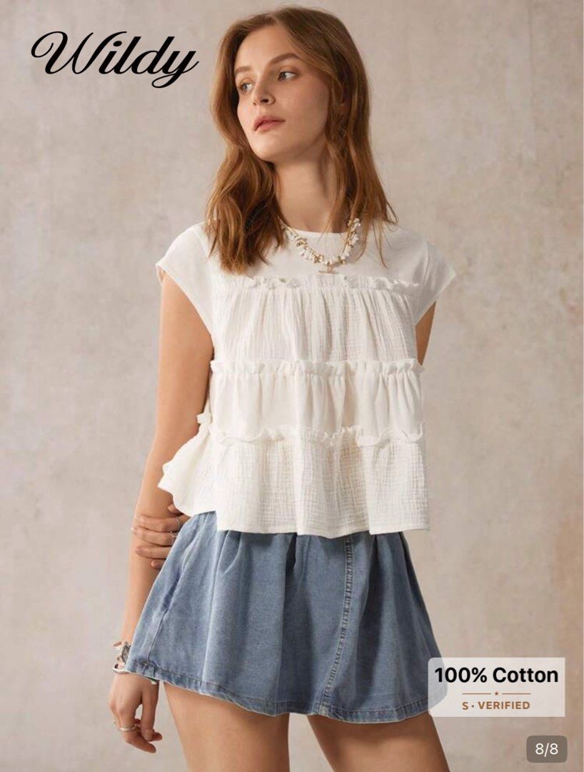 Wildy White Cotton Ruffled Tiered Sleeveless Blouse (Category: Sleeveless) located in Pasig City. Submitted by lai028 (Listing ID 1469534712, Image 1). Description: Super nice fabric, brandnew (selling coz it’s big on me - Size - best fit medium - Brand: Wildy - Material: 100% breathable cotton - Color: White - Design: Three-tiered with delicate ruffled trim details and round neckline - Fit: Casual and breezy - Best paired with: Denim skirts or s