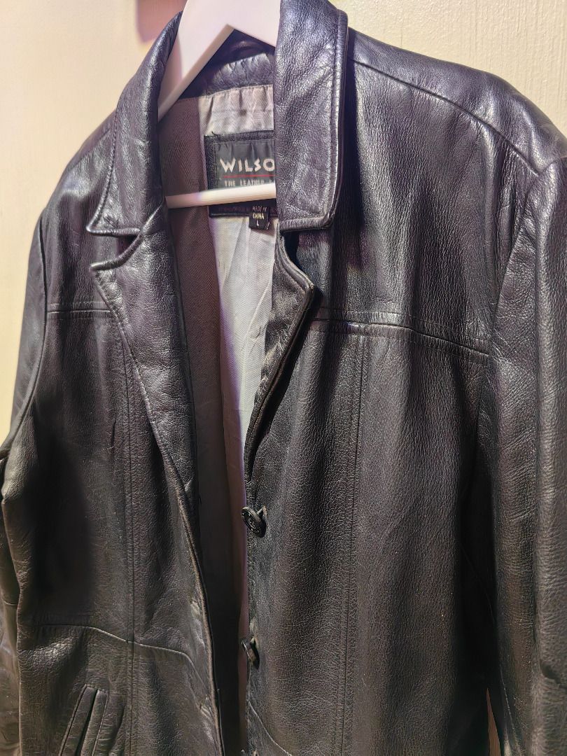 Wilsons Vintage Black Textured Leather Coat Jacket (Category: Coats, Jackets and Outerwear) located in Tarlac. Submitted by jeremiah.curator.2026 (Listing ID 1469400257, Image 3). Description: - Brand: Wilsons - Color: Black with a textured, shiny finish - Closure: Standard button-up front - Design: Classic collar, structured back panels, and stylish striped inner lining - Material/Condition: Warm, durable, heavy winter outerwear - Ideal for: Col