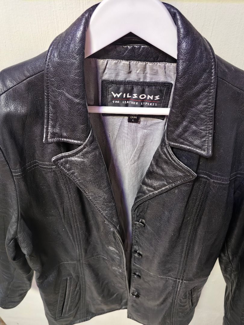 Wilsons Vintage Black Textured Leather Coat Jacket (Category: Coats, Jackets and Outerwear) located in Tarlac. Submitted by jeremiah.curator.2026 (Listing ID 1469400257, Image 2). Description: - Brand: Wilsons - Color: Black with a textured, shiny finish - Closure: Standard button-up front - Design: Classic collar, structured back panels, and stylish striped inner lining - Material/Condition: Warm, durable, heavy winter outerwear - Ideal for: Col