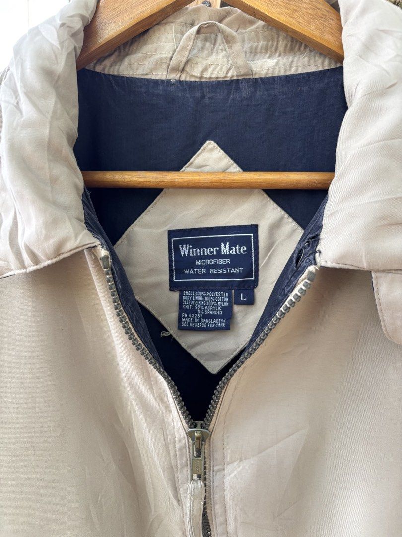Winner Mate Microfiber Water Resistant Jacket Beige Size L (Category: Coats, Jackets and Outerwear) located in San Jacinto. Submitted by ticao_thrift (Listing ID 1469571887, Image 3). Description: - Brand/Model: Winner Mate Microfiber Jacket - Color: Classic beige with navy blue inner lining - Size: L - Material: Water-resistant 100% polyester outer shell, cotton body lining, and nylon sleeve lining - Features: Full zip front, collared neckline, 